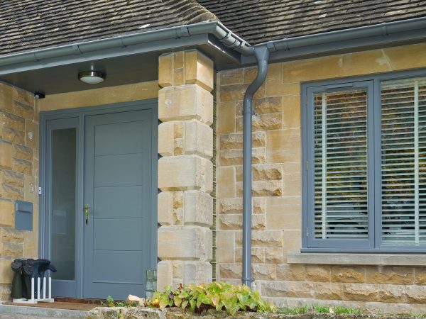 Dusty Grey Colour Coated Galv Steel Gutters and downpipes on a bungalow renovation