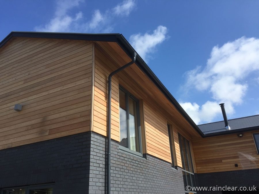 Anthracite Grey colour Coated Galv Gutters and downpipes on a new build