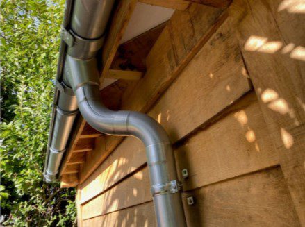 How many Brackets Picture1: Galvanised Steel guttering insitu (gutters and downpipes showing fascia brackets and downpipe clips)